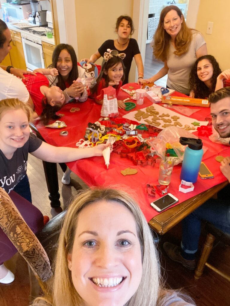 Picture of Sara's family making Christmas cookies together