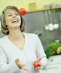 Picture of smiling woman juggling