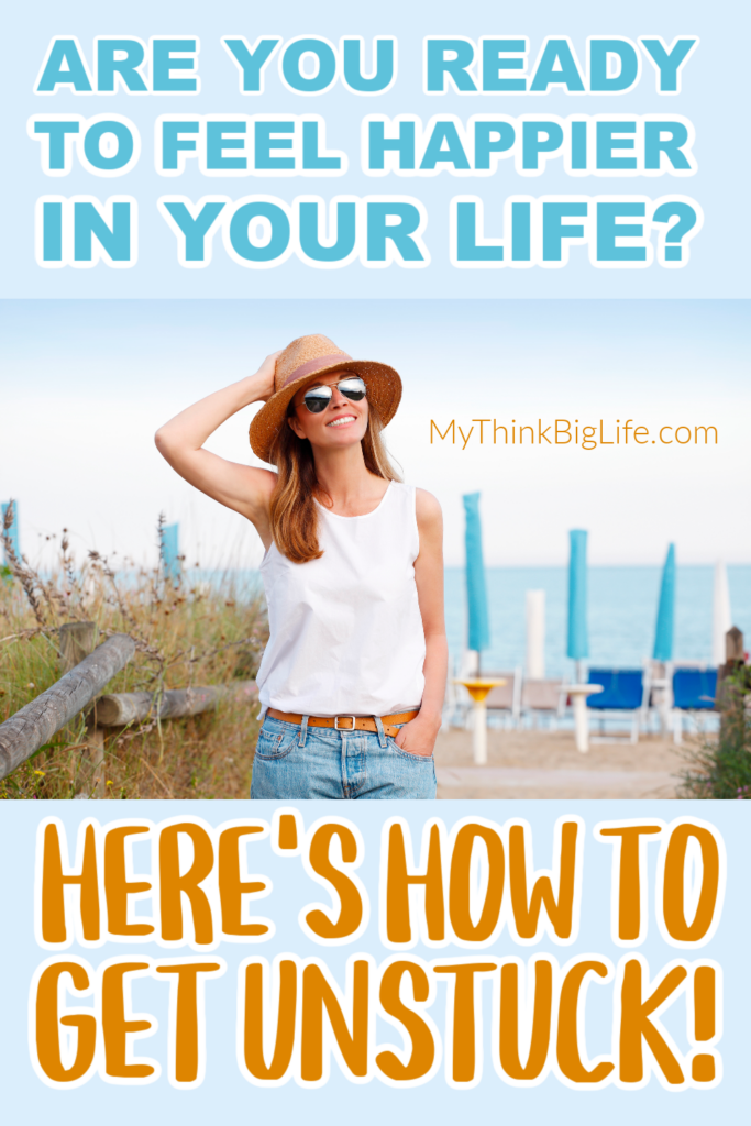 Picture of smiling woman looking up with the words: Are you ready to feel happier in your life? Here's how to get unstuck!