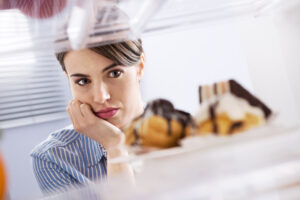Picture of woman looking at desserts