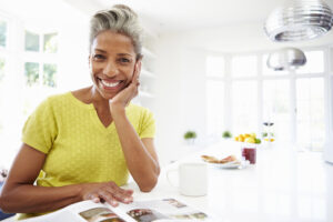 Picture of smiling woman at her kitchen counter