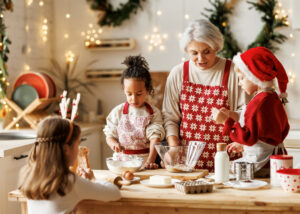 Picture of grandmother making cookies with grandchildren
