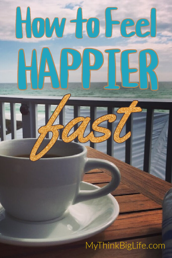 Picture of coffee cup with ocean in the background with the words: how to feel happier fast