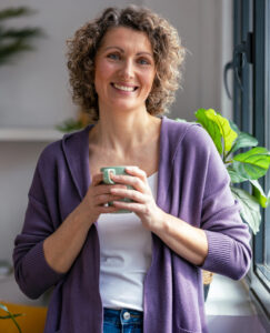 Picture of smiling woman holding a mug