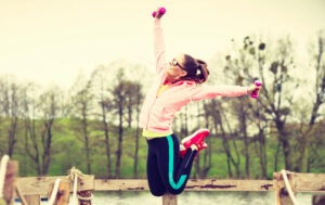 Picture of happy woman jumping in air
