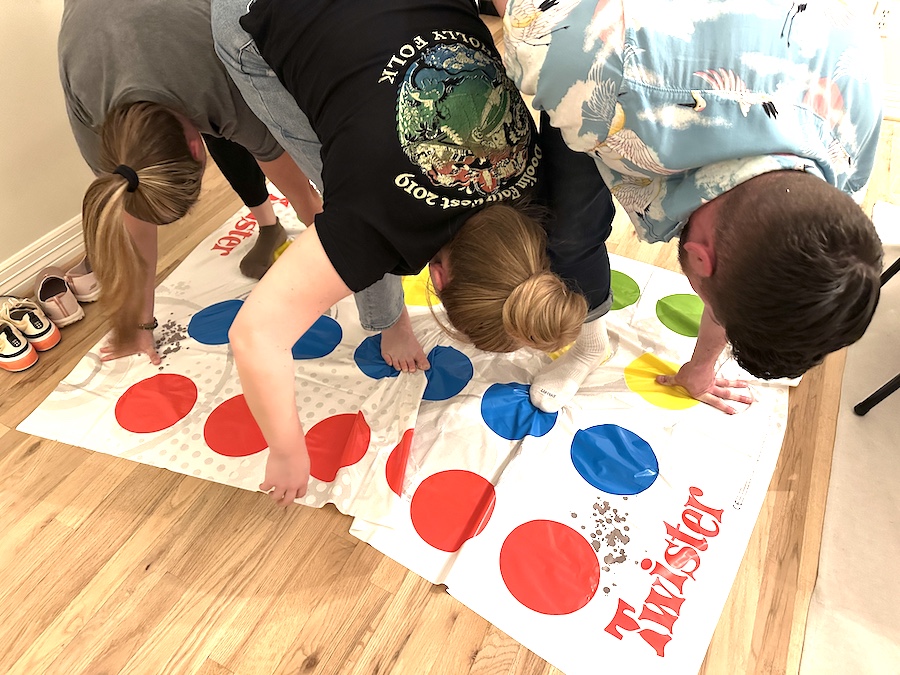 Picture of three people playing twister