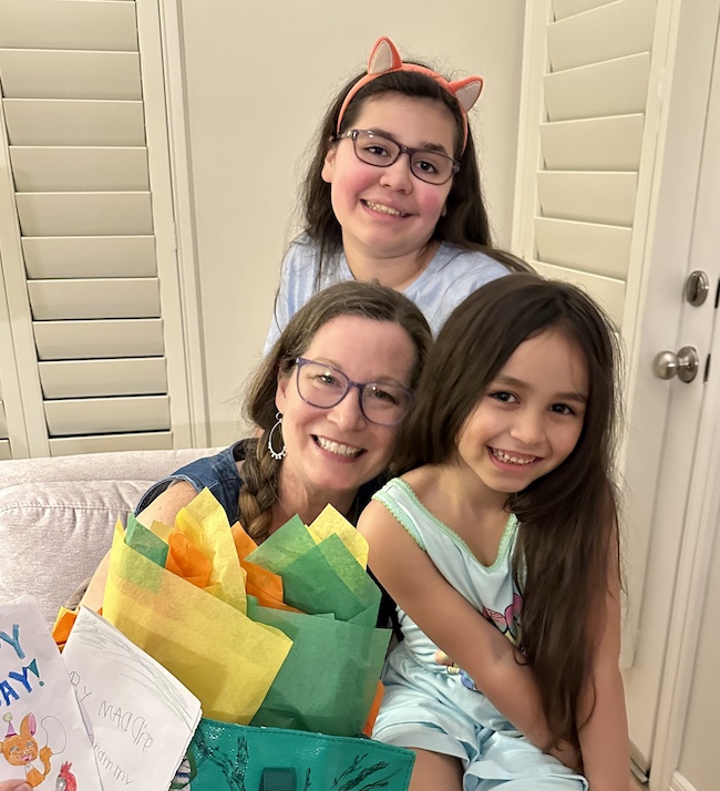 Picture of author Sara with Granddaughters