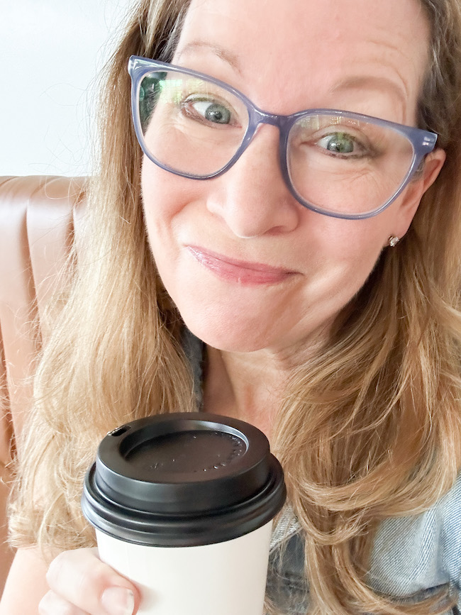 Picture of author Sara with cup of coffee