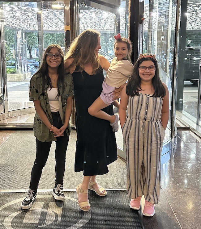 Picture of author sara with grandchildren at hotel