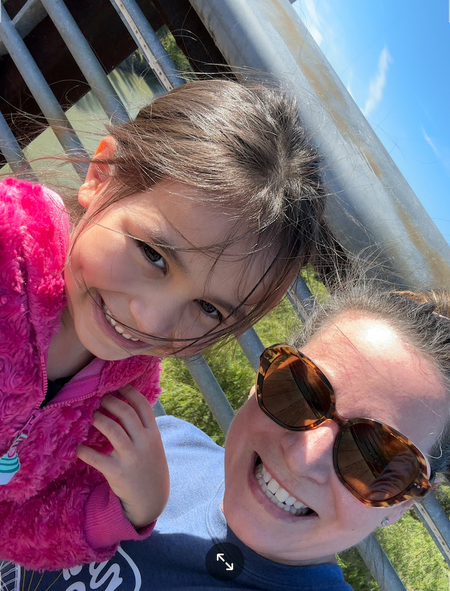 Picture of author Sara with grandchild