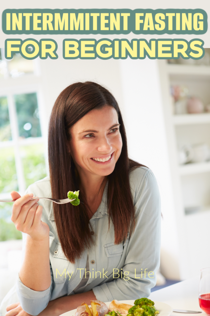 Picture of woman smiling as she lifts a bite of food to eat, with the words: intermittent fasting for beginners