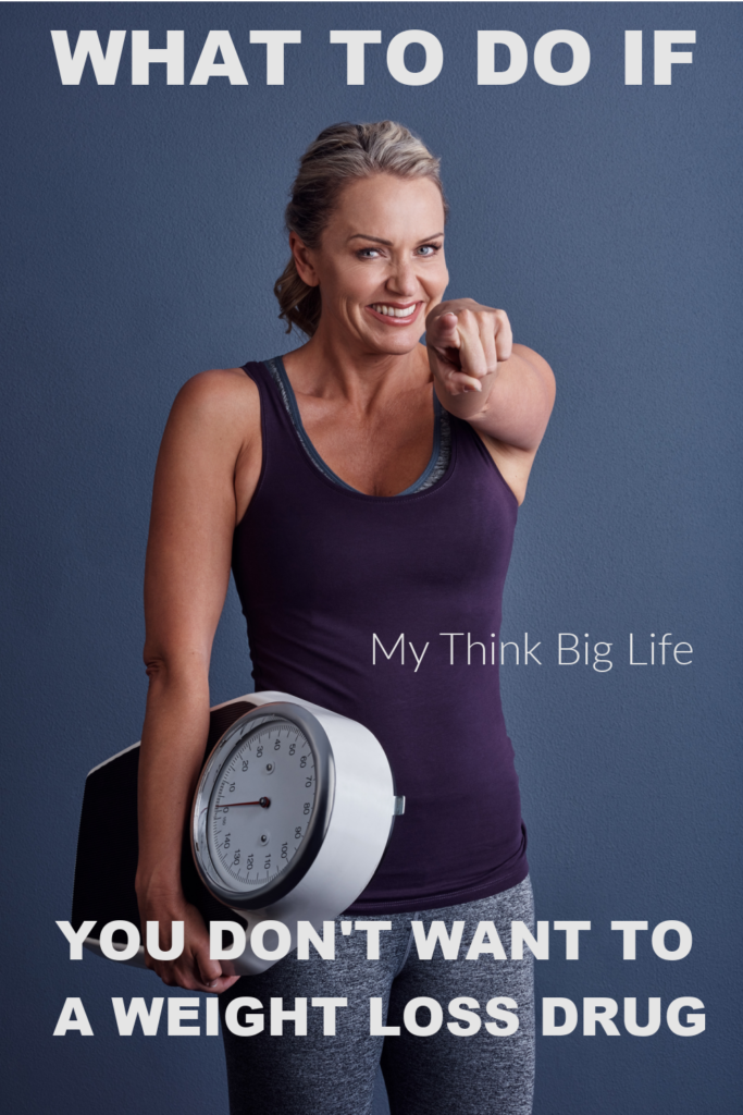PICTURE OF WOMAN HOLDING A SCALE AND POINTING