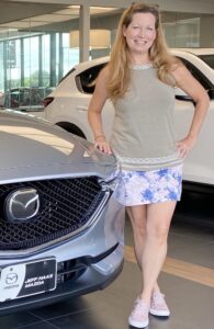 Picture of Sara with a new car. I was stuck with a 14-year old car before! 