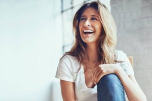 Woman sitting on chair smiling
